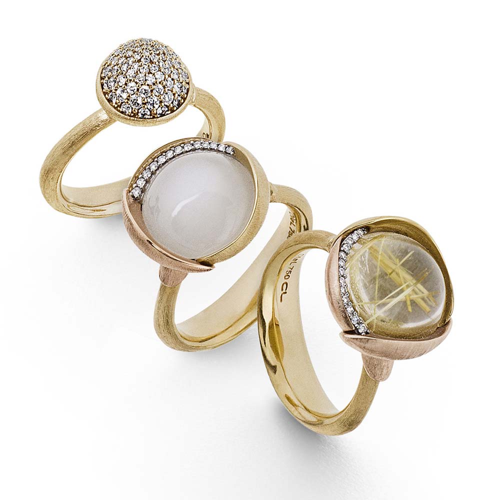 Ole-Lynggaard-Lotus-rings-in-diamond-pave-white-moonstone-and-rutile-quartz-all-in-18ct-yg